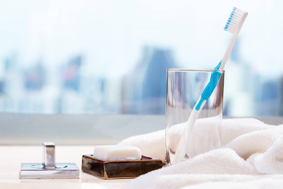 toothbrush in a glass on sink counter